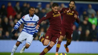 Лоик Реми (слева) против Хави Гарсиа